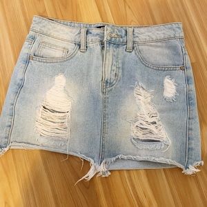 Denim ripped mini jean skirt
